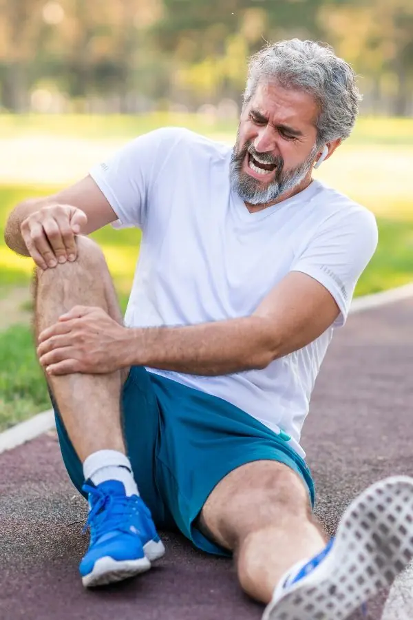 Person clutching their knee